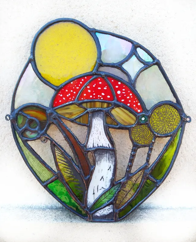 A toadstool stained glass panel